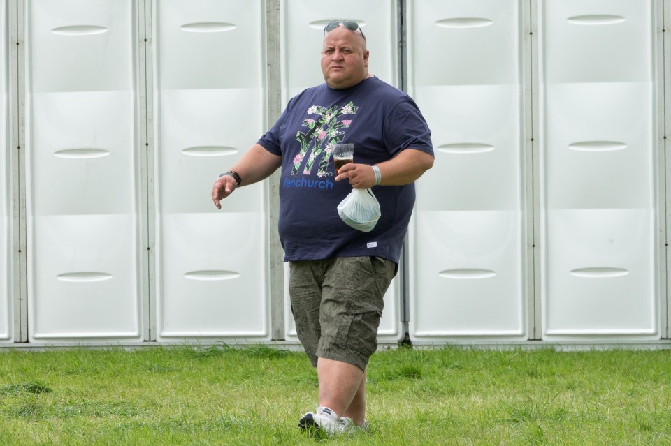 a man wearing a blue shirt that says westchurch