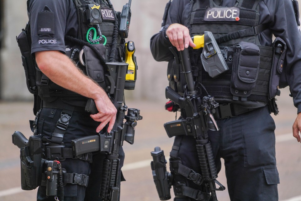 two police officers are standing next to each other