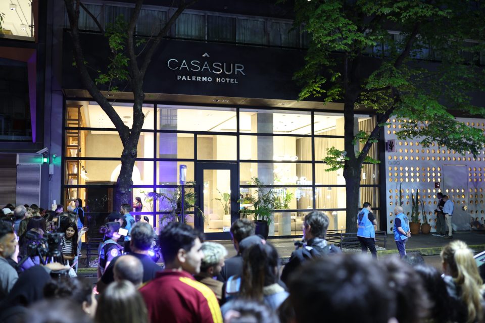 a group of people are gathered outside of casasur palermo hotel