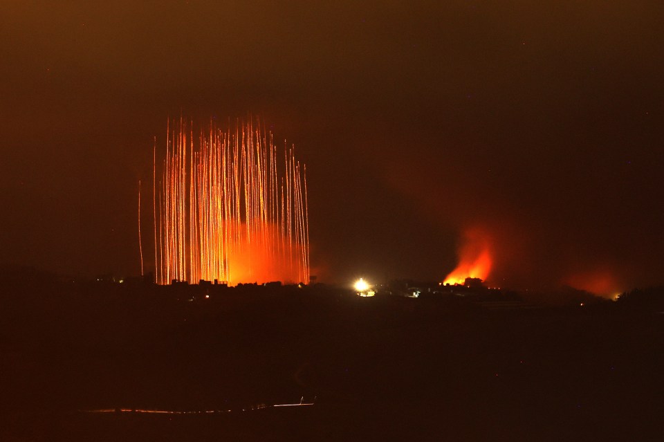 a fireworks display is lit up in the night sky