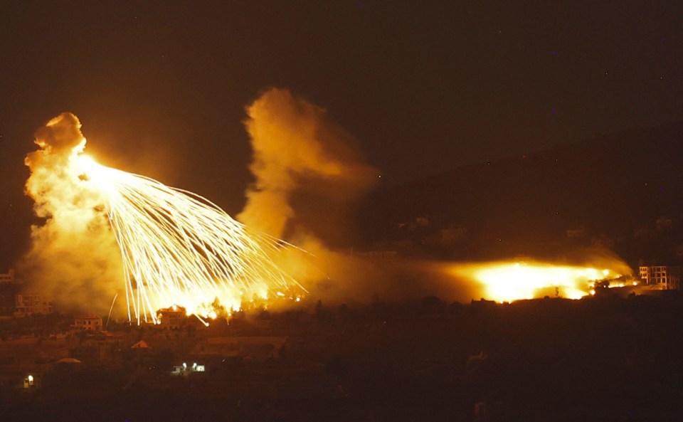 a large fireworks display is going off in the night sky