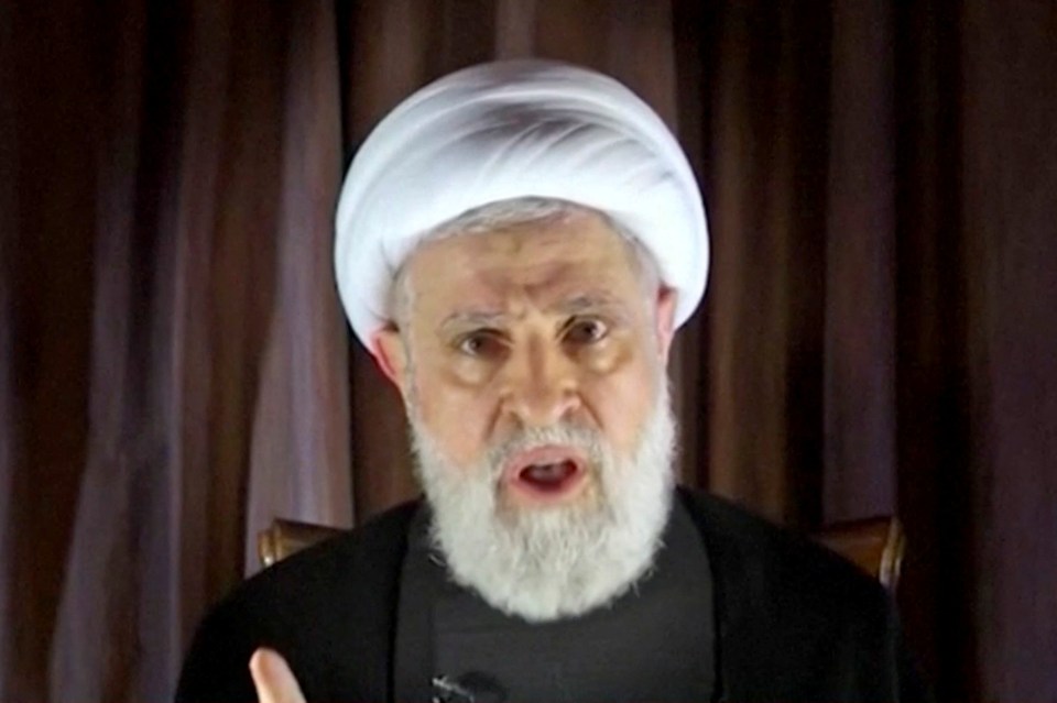 a man with a beard wearing a white turban