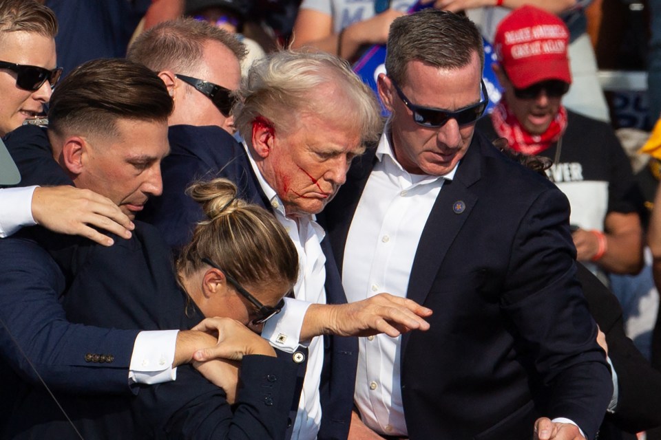a man wearing a red hat that says make america great again