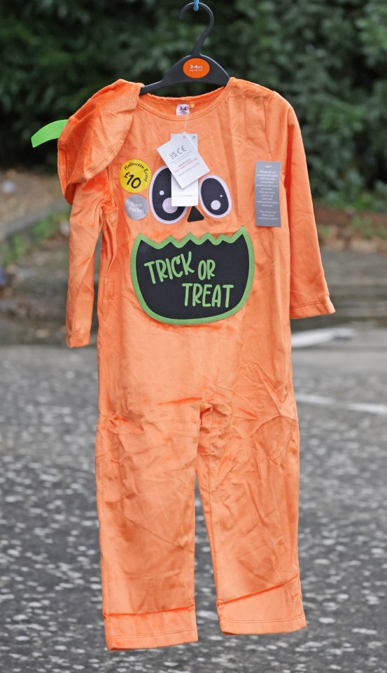 a trick or treat costume is hanging on a hanger