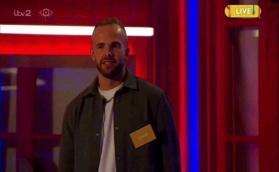 a man with a name tag that says adam on it