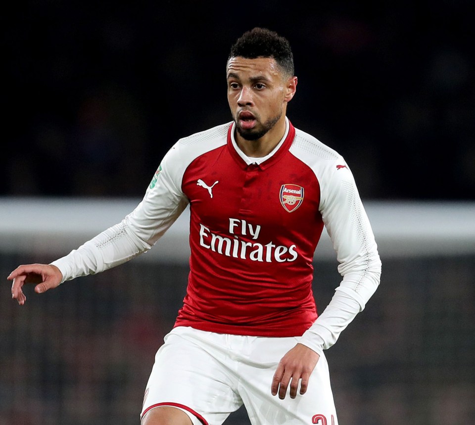 a soccer player wearing a fly emirates jersey