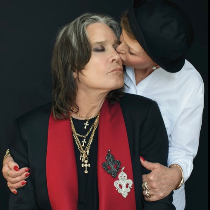a woman kisses another woman on the cheek