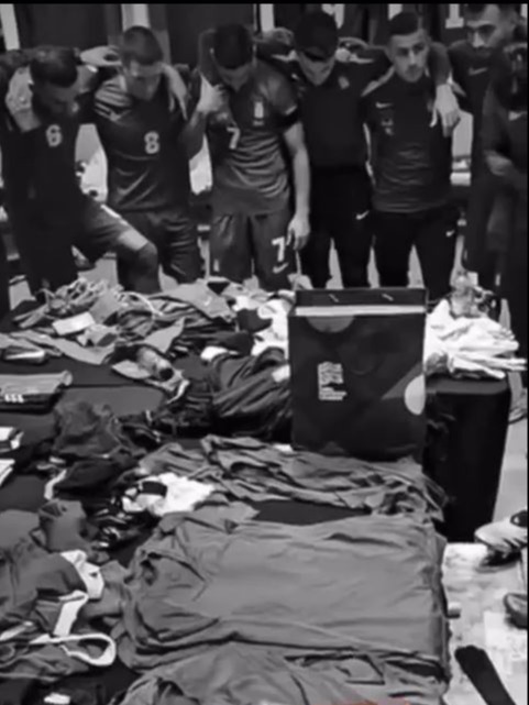 a group of soccer players standing around a pile of shirts with the words no one and we 'll at the bottom