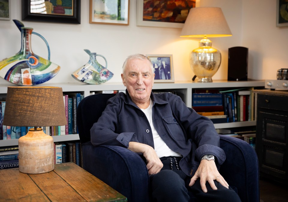 a man sits in a chair with a lamp in front of him