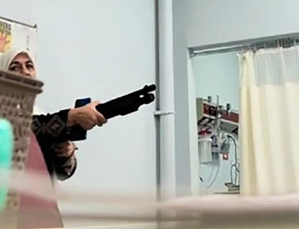 Birgul G. 45, pointed the gun at hospital staff and threatened to open fire in the scary footage