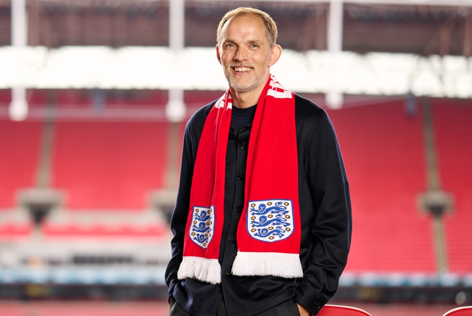 a man wearing a scarf that says england on it