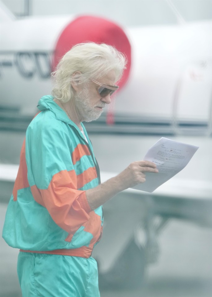 BGUK_3071946 - *EXCLUSIVE* Gold Coast, AUSTRALIA - WEB MUST CALL FOR PRICING - STRICTLY NOT AVAILABLE FOR DAILY MAIL ONLINE USAGE - Sir Bob Geldof looks over his lines for his part in a zombie plane movie being filmed at Gold Coast Airport. Pictured: Sir Bob Geldof BACKGRID UK 28 OCTOBER 2024 *STRICTLY NOT AVAILABLE FOR MAIL ONLINE* UK: +44 208 344 2007 / uksales@backgrid.com USA: +1 310 798 9111 / usasales@backgrid.com *Pictures Containing Children Please Pixelate Face Prior To Publication*