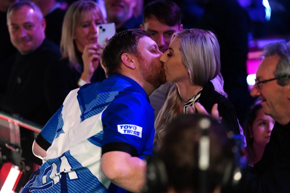 Fallon Sherrock and Cameron Menzies (left) embrace on day one of the Paddy Power World Darts Championship at Alexandra Palace, London. Picture date: Friday December 15, 2023. PA Photo. See PA story DARTS World. Photo credit should read: Zac Goodwin/PA Wire RESTRICTIONS: Use subject to restrictions. Editorial use only, no commercial use without prior consent from rights holder.