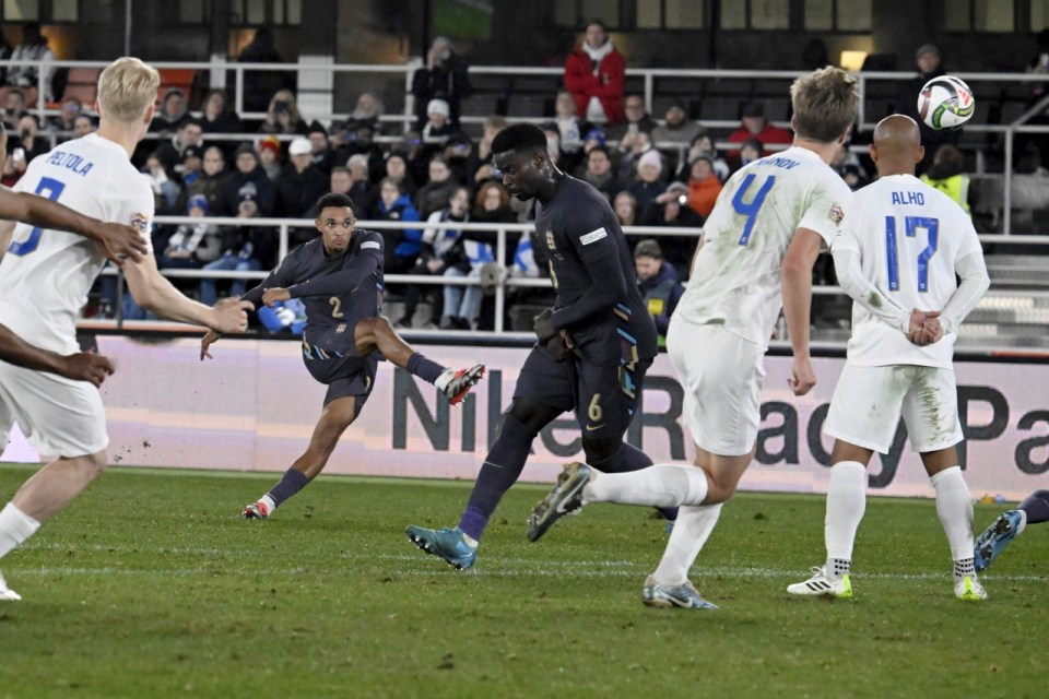 England's Trent Alexander-Arnold, second from left, scores his sides second goal during the UEFA Nations League soccer match between Finland and England, at the Olympic Stadium in Helsinki, Finland, Sunday, Oct. 13, 2024. (Markku Ulander/Lehtikuva via AP)