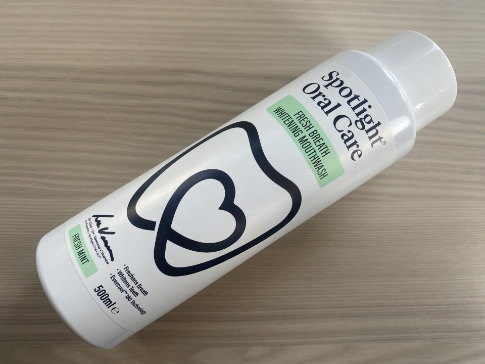 a bottle of spotlight oral care fresh breath whitening mouthwash