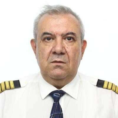 a man in a white shirt and tie is standing in front of a white background .