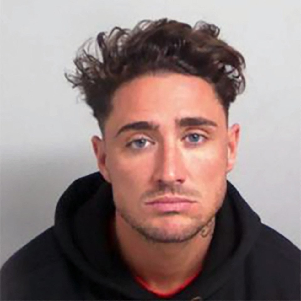 a man with curly hair and a beard is wearing a black hoodie .