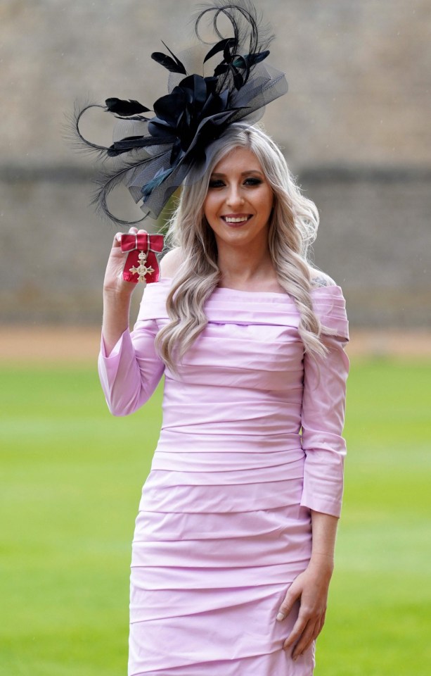 English professional darts player Fallon Sherrock poses with their medal after being appointed a Member of the Order of the British Empire (MBE) following an investiture ceremony at Windsor Castle on November 1, 2023. (Photo by Andrew Matthews / POOL / AFP) (Photo by ANDREW MATTHEWS/POOL/AFP via Getty Images)