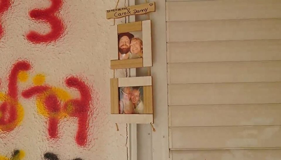 a picture of carol and jerry hangs on a wall