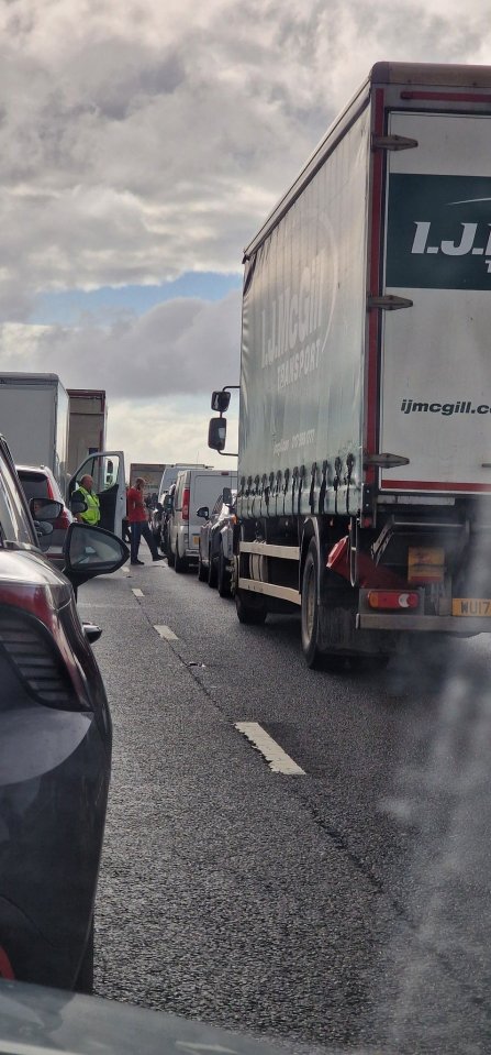 a j.j.mcgill transport truck is driving down a highway