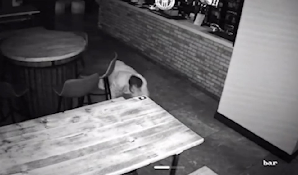 Shamsul Islam seen on CCTV crawling on the floor of a bar to steal from the till. Release date October 30 2024. A bungling burglar who was captured crawling around pubs and restaurants in an attempt to evade CCTV cameras has been jailed. Shamsul Islam, 40, stole thousands of pounds in cash and property after breaking into seven different businesses while creeping about on all fours. And while the dopy thief thought his technique had concealed his identity, cameras in the commercial properties, in Bury, Grtr. Manchester, caught his every move. He was eventually rumbled when a restaurant owner received a phone alert that someone was inside his premises at 2.15am and watched the burglary unfold. Islam disturbed an alarm at the premises and left a small amount of blood after smashing a glass during his frantic escape that helped police identify him.