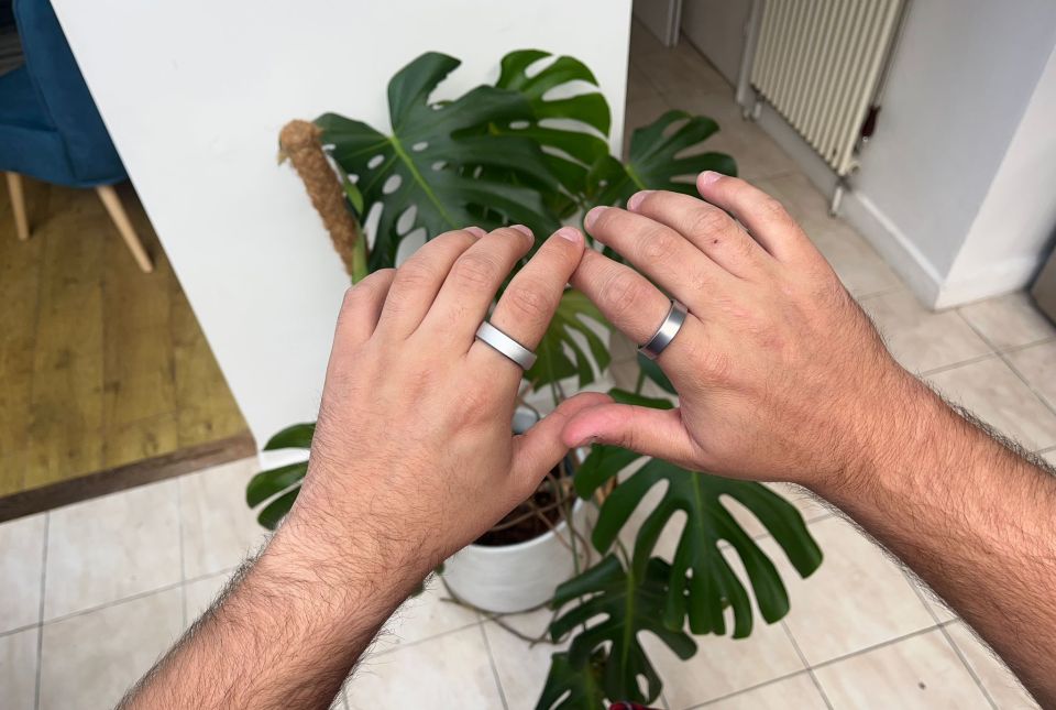 a man wearing a silver ring on his left hand