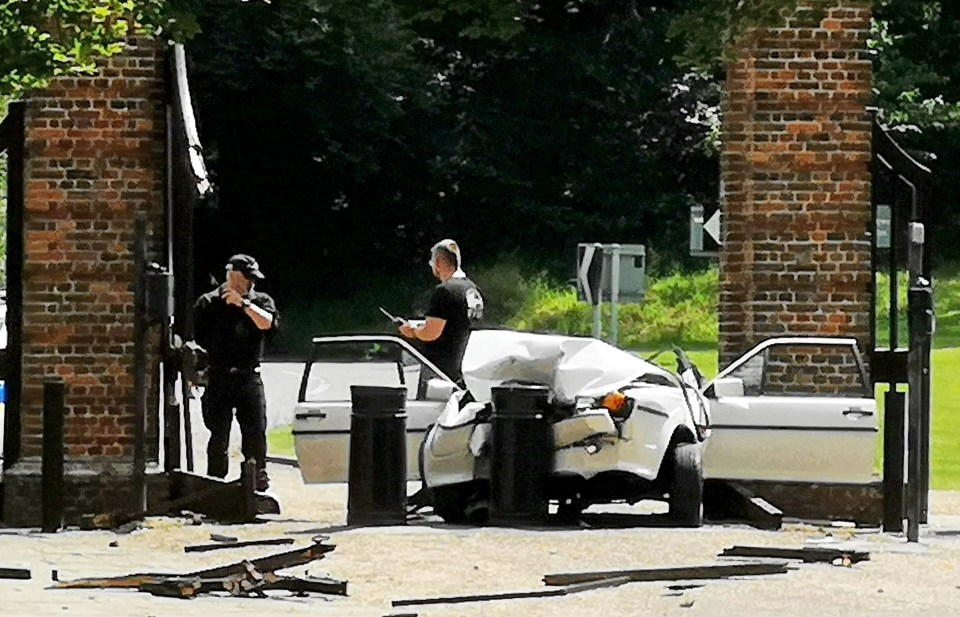 a picture of a car that has crashed into a brick wall