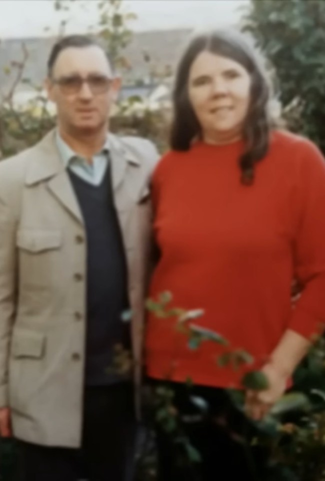 a man and a woman are posing for a picture with itv in the background