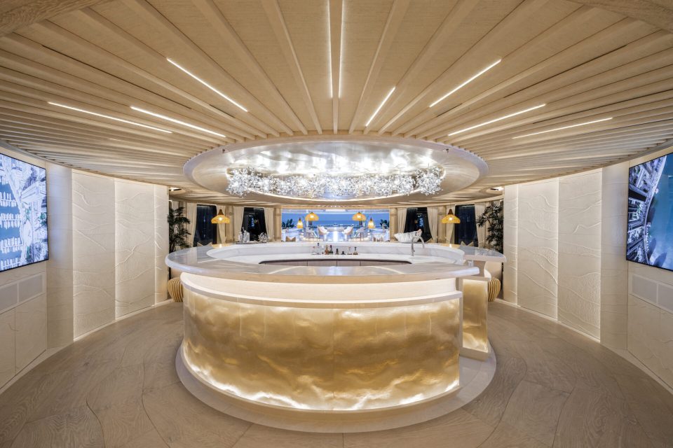a circular bar with a large chandelier above it