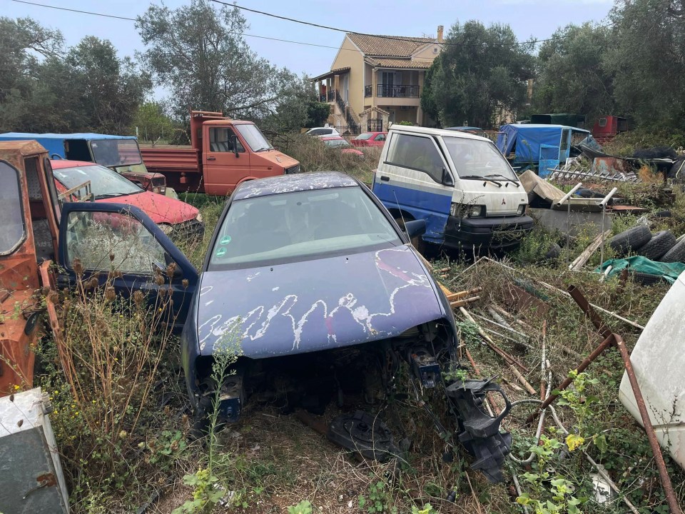 a blue car has the word cobra written on the windshield