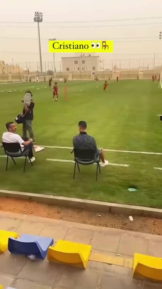 a soccer field with a sign that says cristiano on it