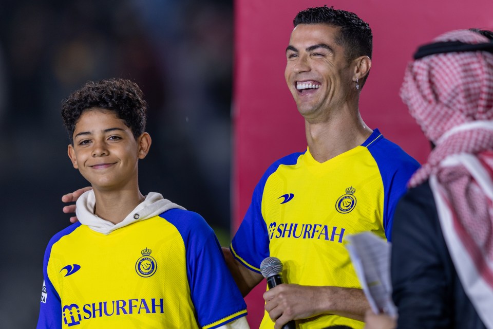 a man in a yellow and blue shirt with the word shurfah on it