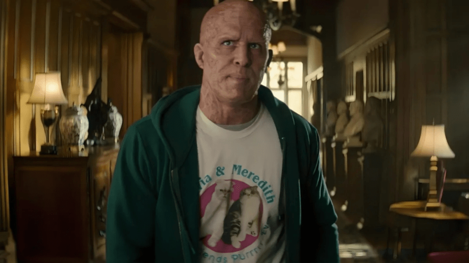 a bald man wearing a shirt that says ta & meredith