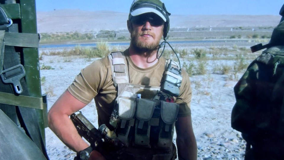 a man wearing a t-shirt that says ' army ' on it