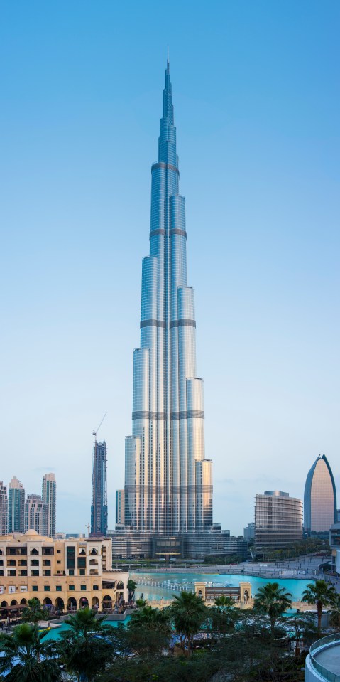 a very tall building with a blue sky in the background