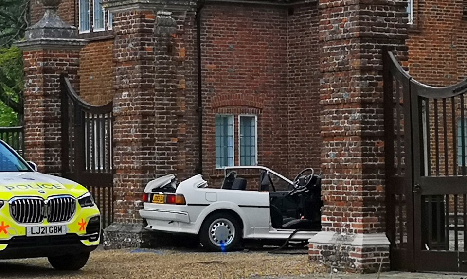 a white car with a license plate that says lj21 gbn