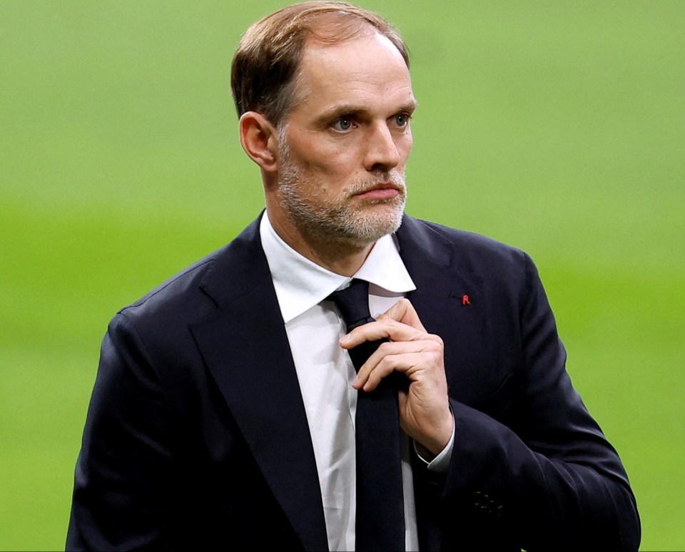 a man in a suit and tie with the letter r on his shirt
