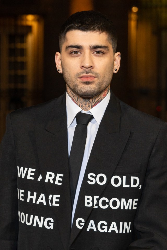 a man in a suit has a shirt that says we are so old we have become young again