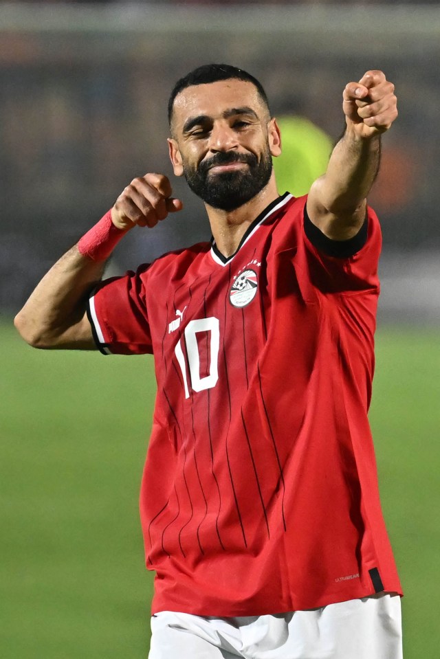 a man with a beard wears a red jersey with the number 10 on it