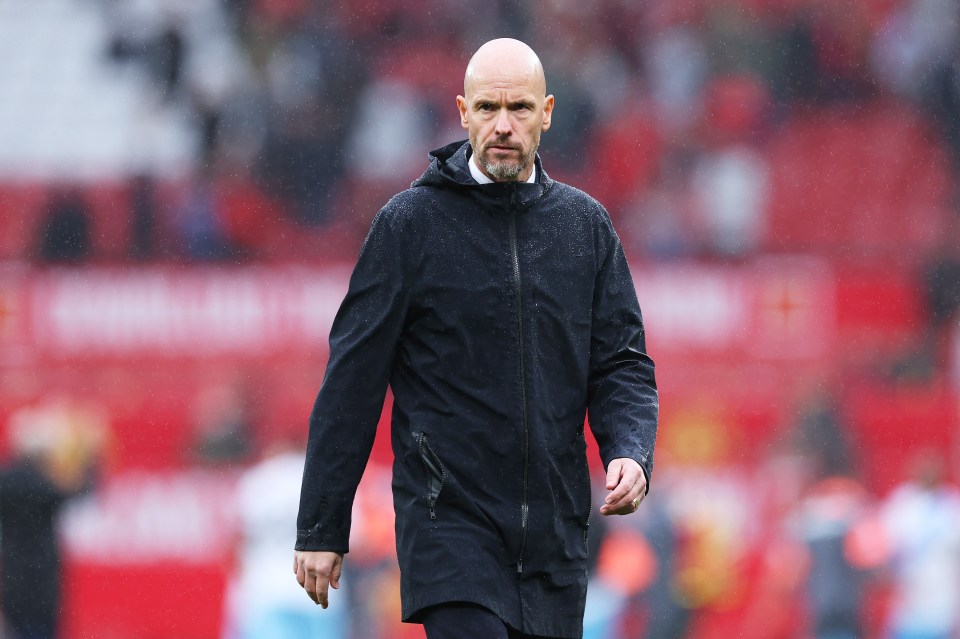a bald man with a beard wearing a black jacket