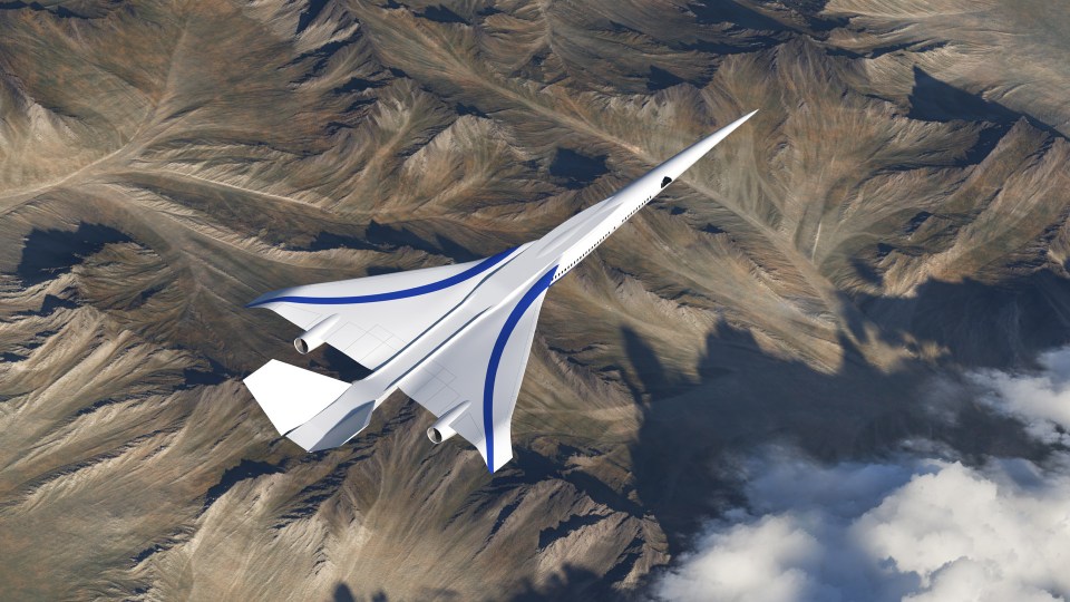 a white and blue plane is flying over a mountain range