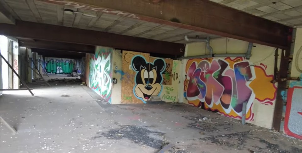 a wall with graffiti on it including one that says " proud of mickey "