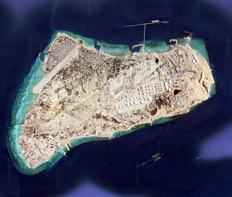 an aerial view of a small island in the middle of the ocean