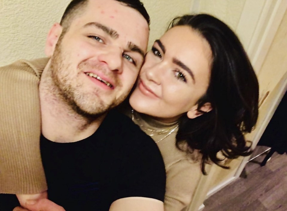 a man and a woman are posing for a picture together