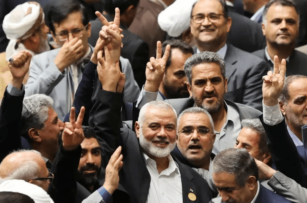 a group of men are giving the peace sign
