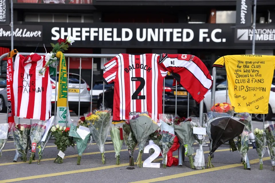 baldock 's number 2 jersey is displayed in front of a sign that says sheffield united f.c.