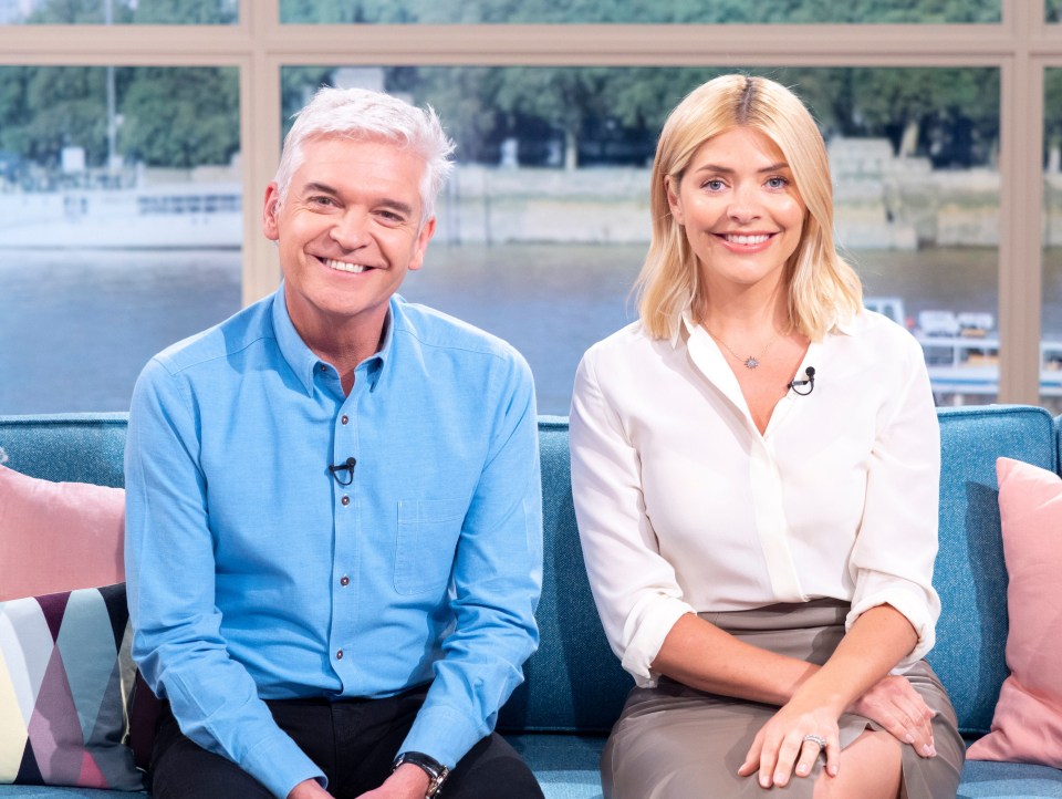 a man and a woman sit next to each other on a couch