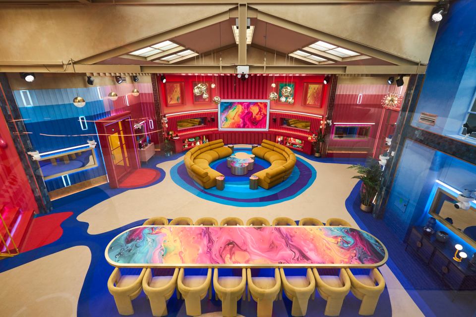 a colorful room with a large table in the middle