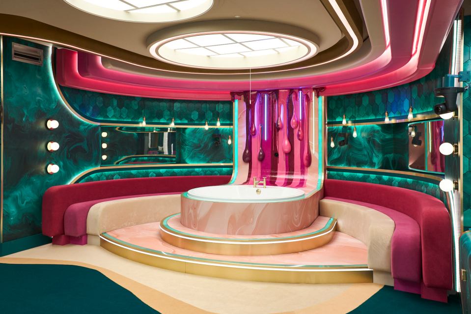 a colorful bathroom with a circular tub in the middle