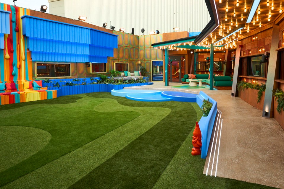 a colorful building with a lawn in front of it